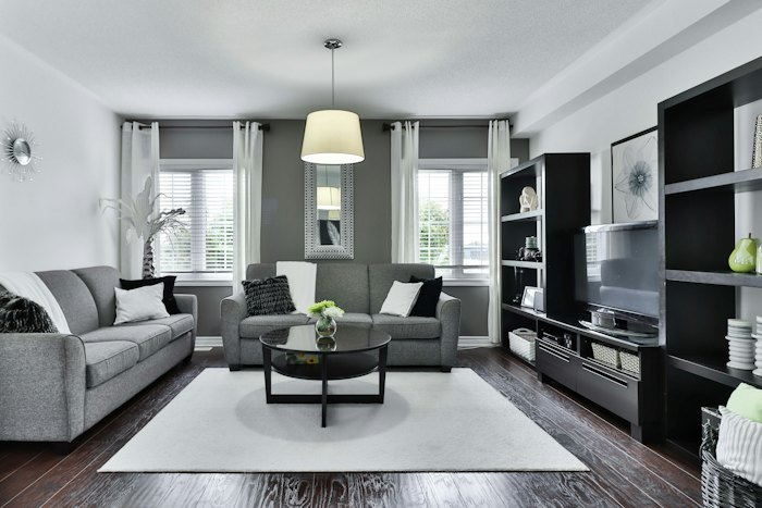 Living room with floor-to-ceiling built-in joinery and a media wall.